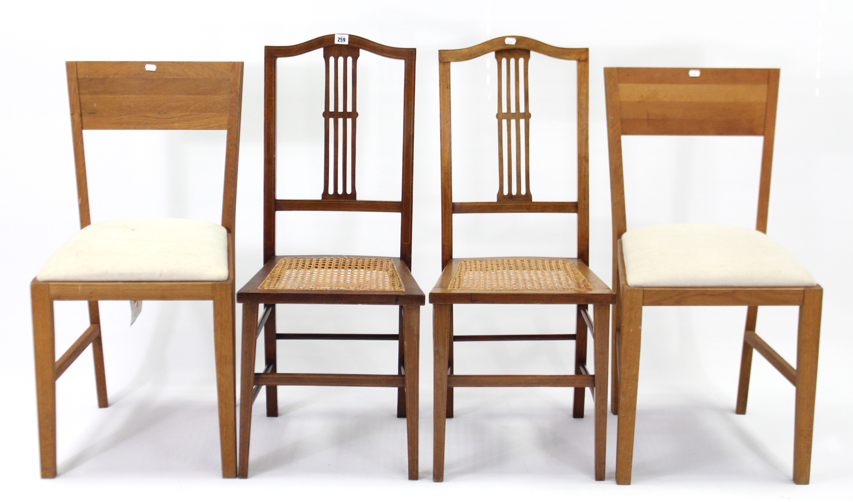 A pair of Edwardian inlaid-mahogany splat-back occasional chairs, with woven cane seats & on