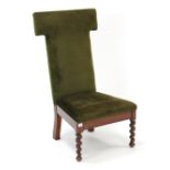 A Victorian mahogany prie-dieu chair, the tall padded back & sprung seat upholstered green velour, &