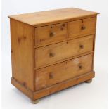 A Victorian pine small chest fitted two short & two long graduated drawers with turned knob handles,