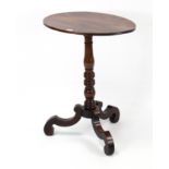 A 19th century mahogany tripod table with oval top, & on vase-turned centre column & three