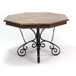 A mahogany octagonal extending dining table with three additional leaves, pull-out action, & on