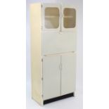 A mid-20th century “County” white-painted wooden tall kitchen cabinet, 29¾” wide x 70½” high.