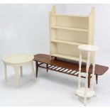 A white painted wooden four-tier standing open bookcase, 31½” wide; together with a white painted