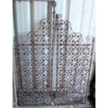 A pair of wrought-iron garden gates with stylised geometric design, each gate 18” wide x 54½” high.