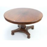 A 19th century mahogany pedestal dining table with circular tilt-top, & on square tapered centre