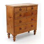 A late Victorian pine chest fitted two short & three long graduated drawers with turned knob