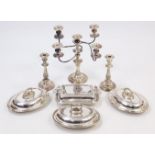 A silver plated four-branch table candelabra, 13½” high; a ditto pair of candlesticks, 9” high; &
