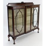 An Edwardian mahogany break-front china display cabinet, fitted two plate glass shelves enclosed