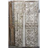 A large pair of white painted wrought-iron garden gates with wheat-ear decoration, each gate 82”