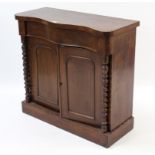 A 19th century mahogany serpentine-front chiffonier base, fitted frieze drawer above cupboard