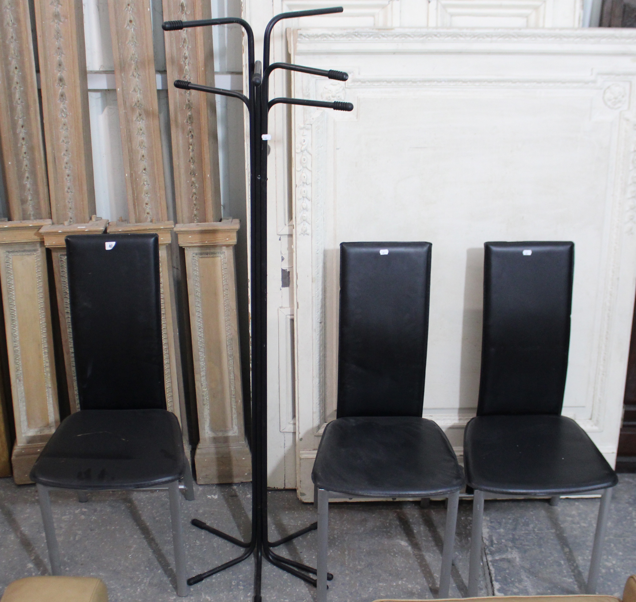 A set of three black vinyl & silvered-metal frame dining chairs; & a black-finish hat & coat stand.