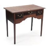 An oak low-boy, fitted three frieze drawers & on square tapered legs, 36½” wide.
