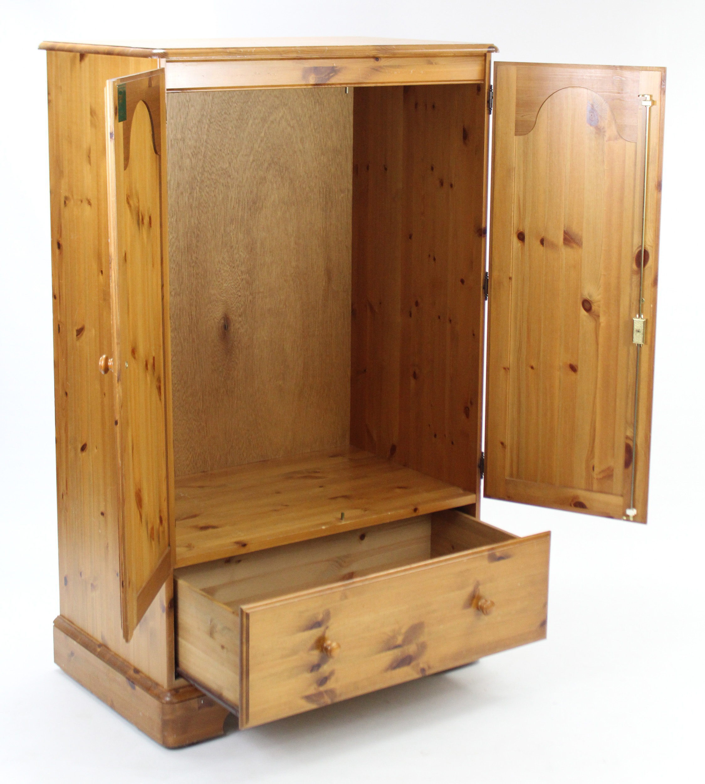 A pine nursery cupboard, enclosed by pair of fielded panel doors above a deep long drawer, & on - Image 2 of 2