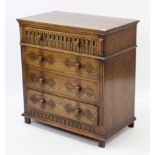 A small oak chest, fitted four long drawers & on block feet, 31” wide x 33” high.