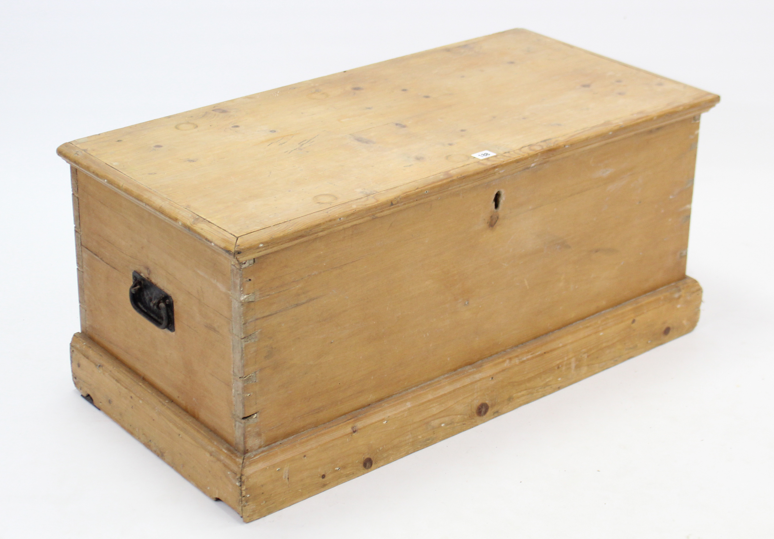 A Victorian pine blanket box with hinged lift-lid, wrought-iron side handles, & on plinth base, 37¼”