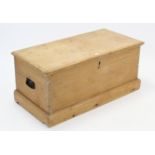 A Victorian pine blanket box with hinged lift-lid, wrought-iron side handles, & on plinth base, 37¼”