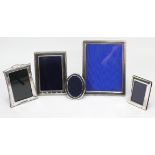 Five various silver photograph frames.