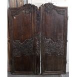 A pair of carved hardwood doors from a vintage armoire, 29½” wide x 70” high (w.a.f.); & a