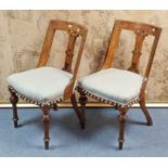 A set of six late Victorian carved oak Athenian-style dining chairs with pierced splat backs, padded