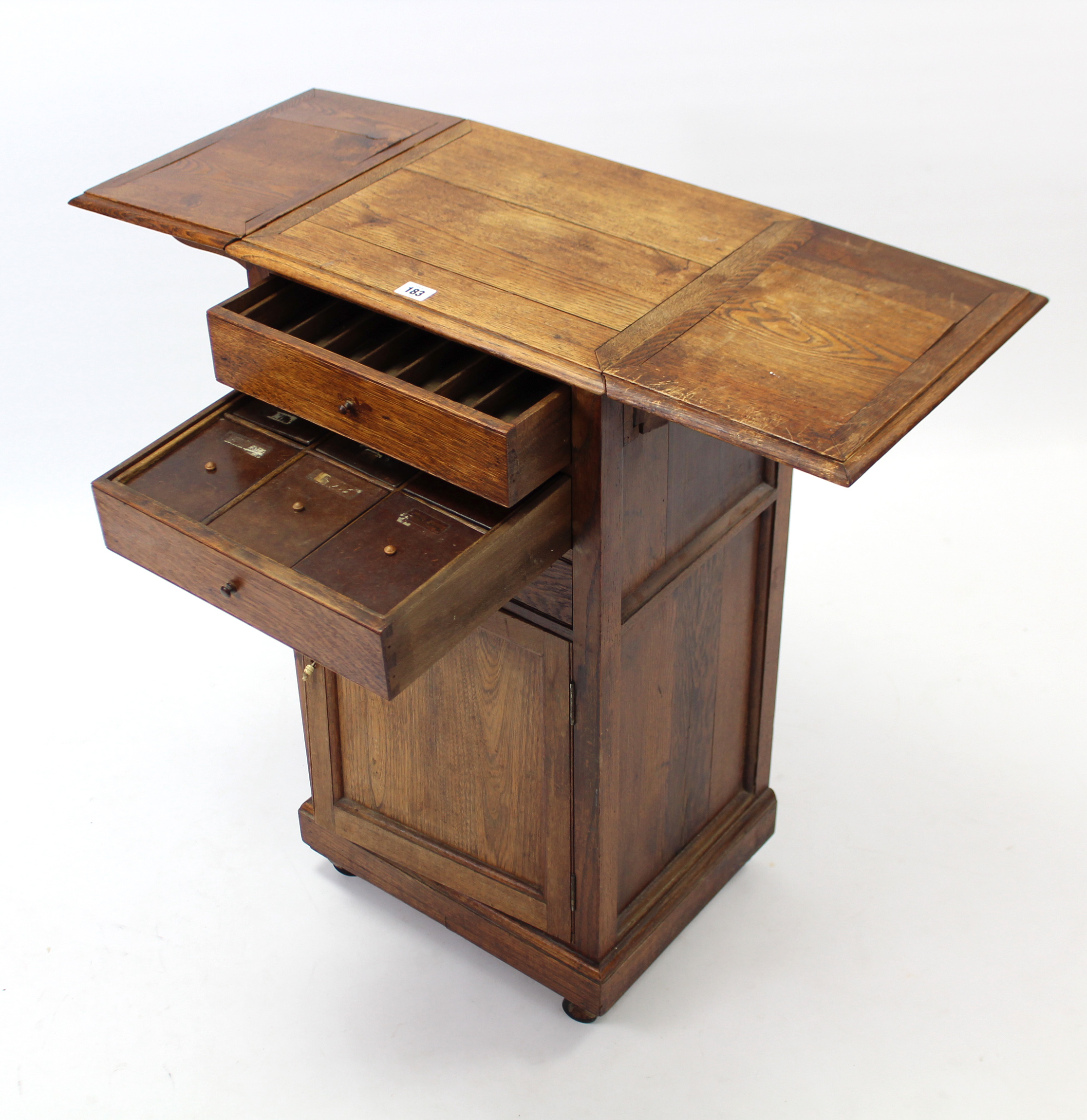 An early 20th century oak drop-leaf bedside cabinet fitted three long drawers above cupboard - Image 2 of 6