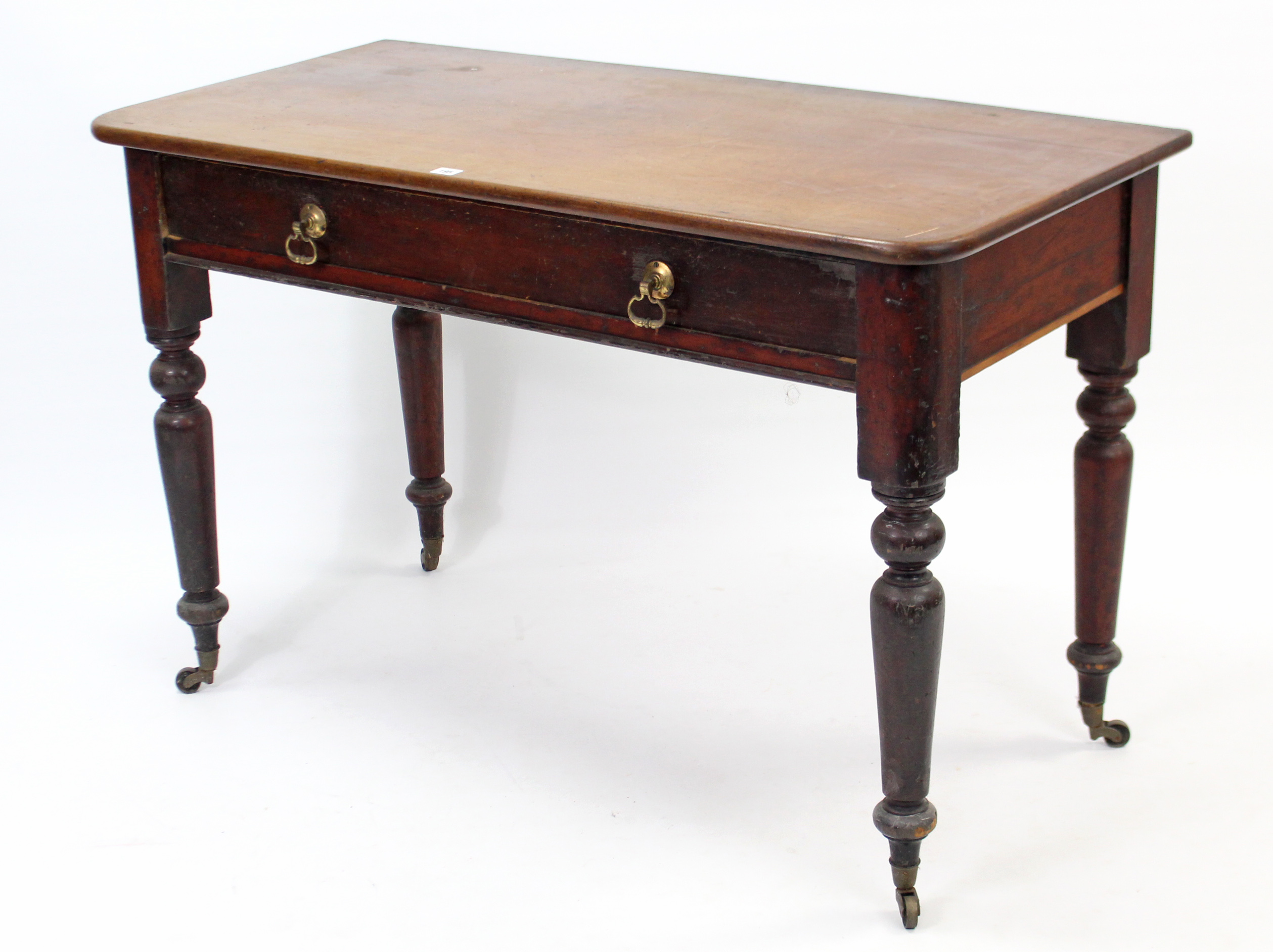 A Victorian mahogany side table with rounded corners to the rectangular top, fitted two frieze