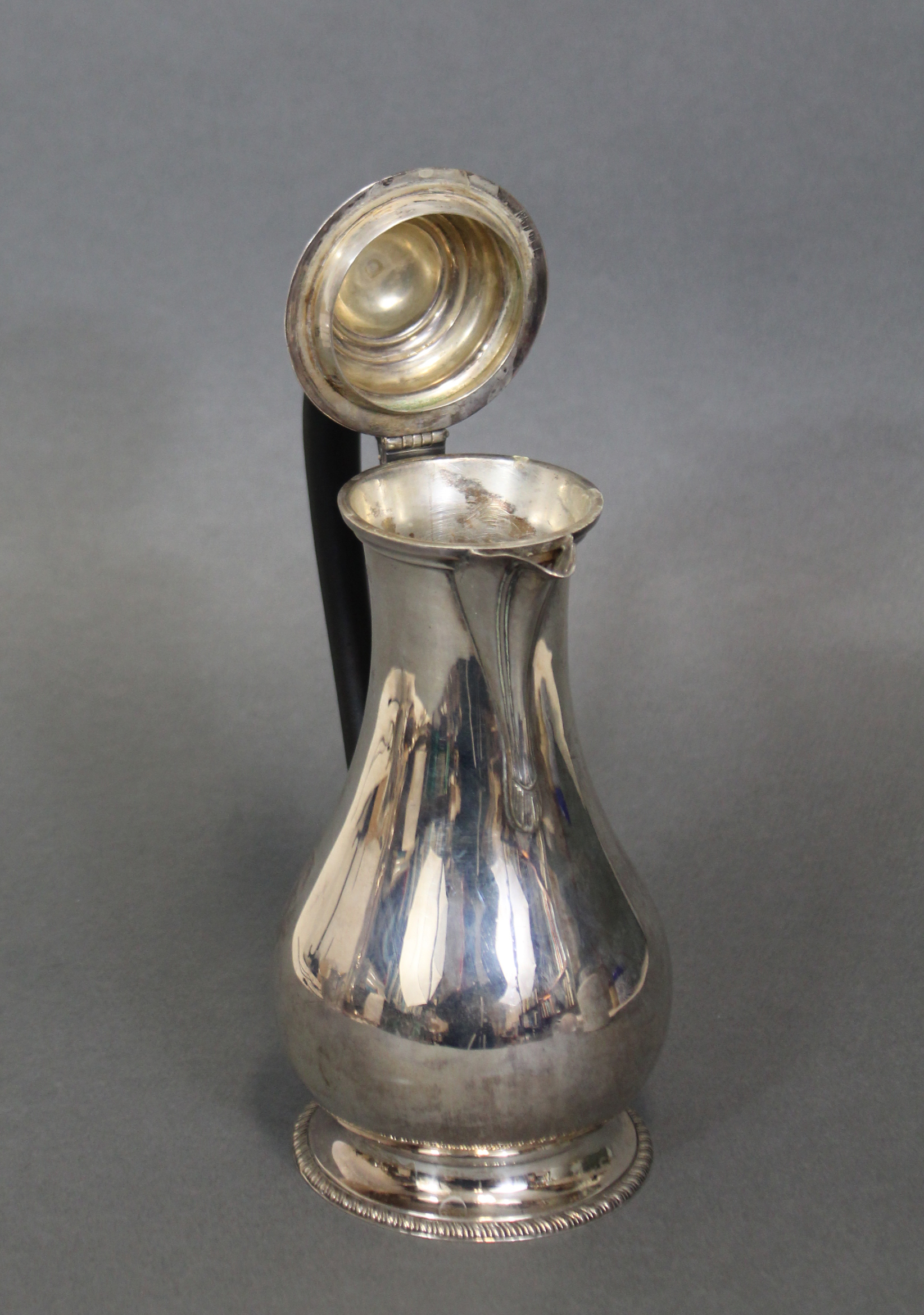 An 18th century-style hot water jug of baluster shape with ebonised scroll handle, hinged lid & on - Image 3 of 3