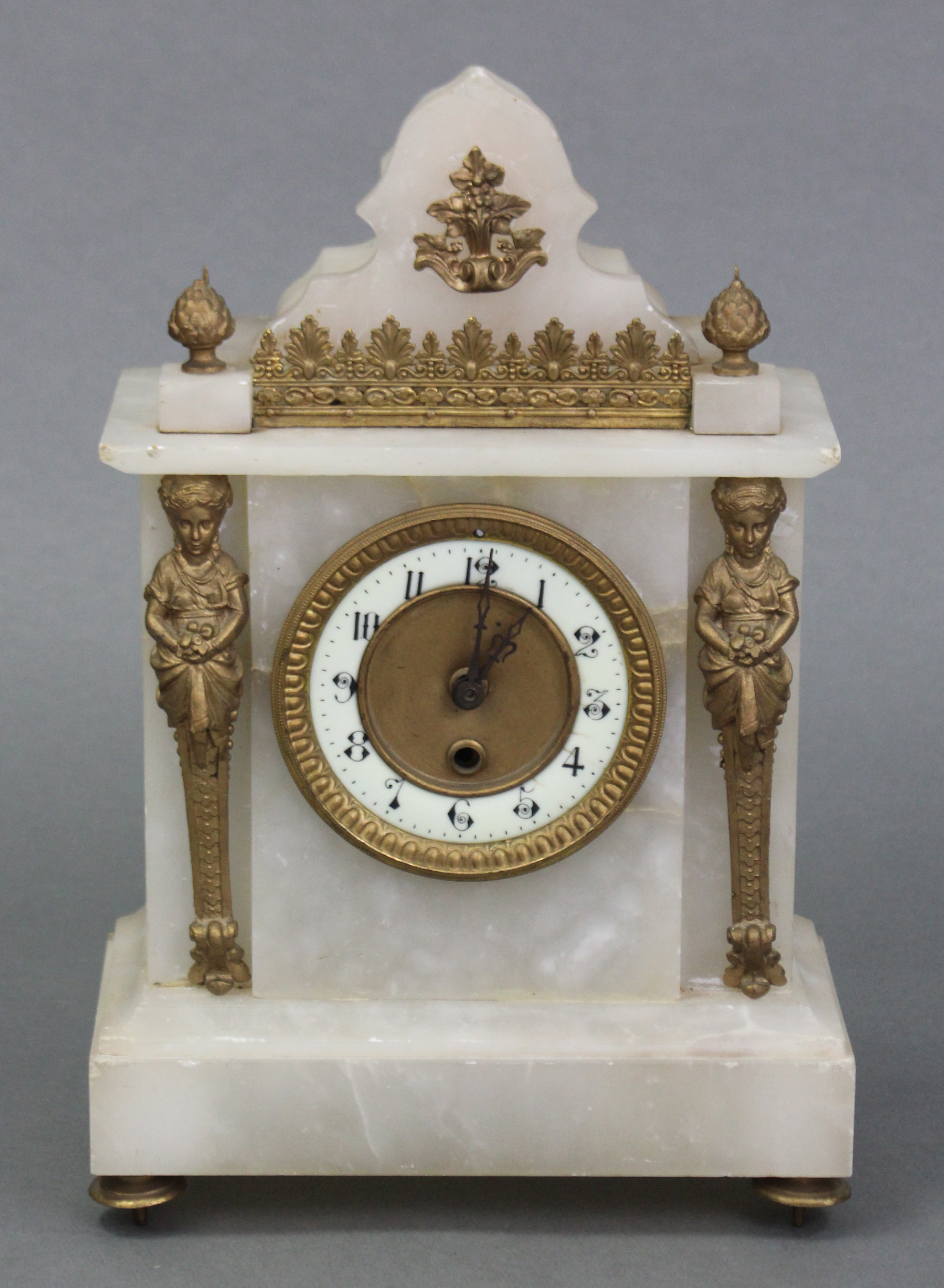 A 19th century style mantel clock, the 3¾” dial with arabic numerals & electrically-operated