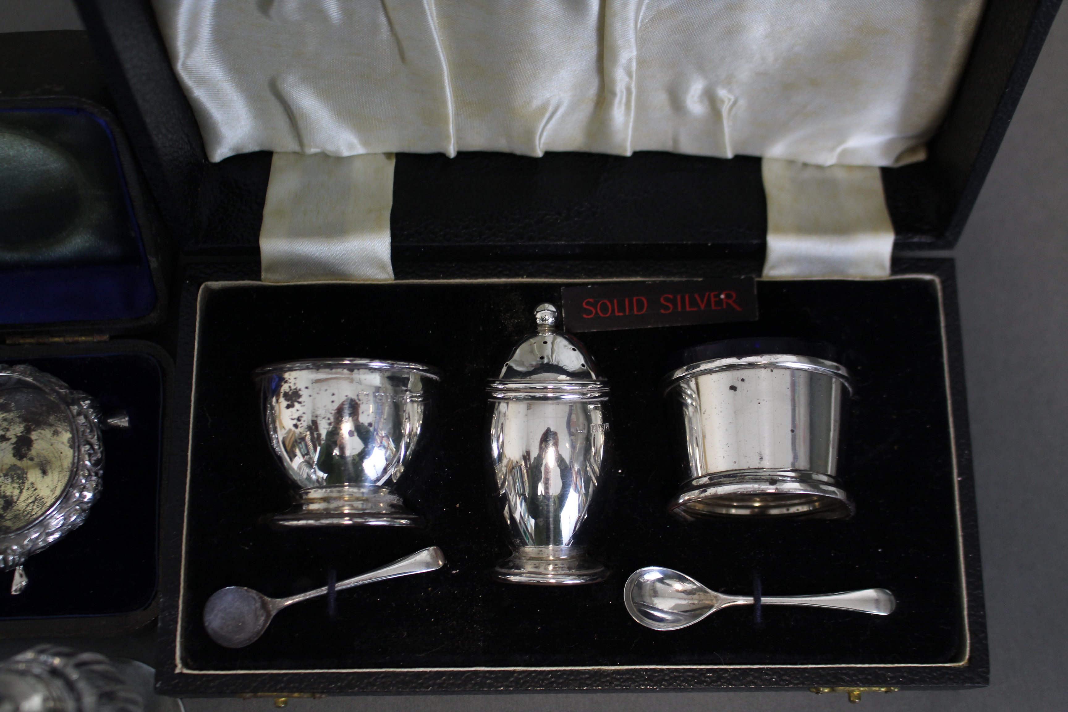 A pair of silver circular salt cellars with embossed shell & scroll decoration, each on three pad - Image 3 of 3