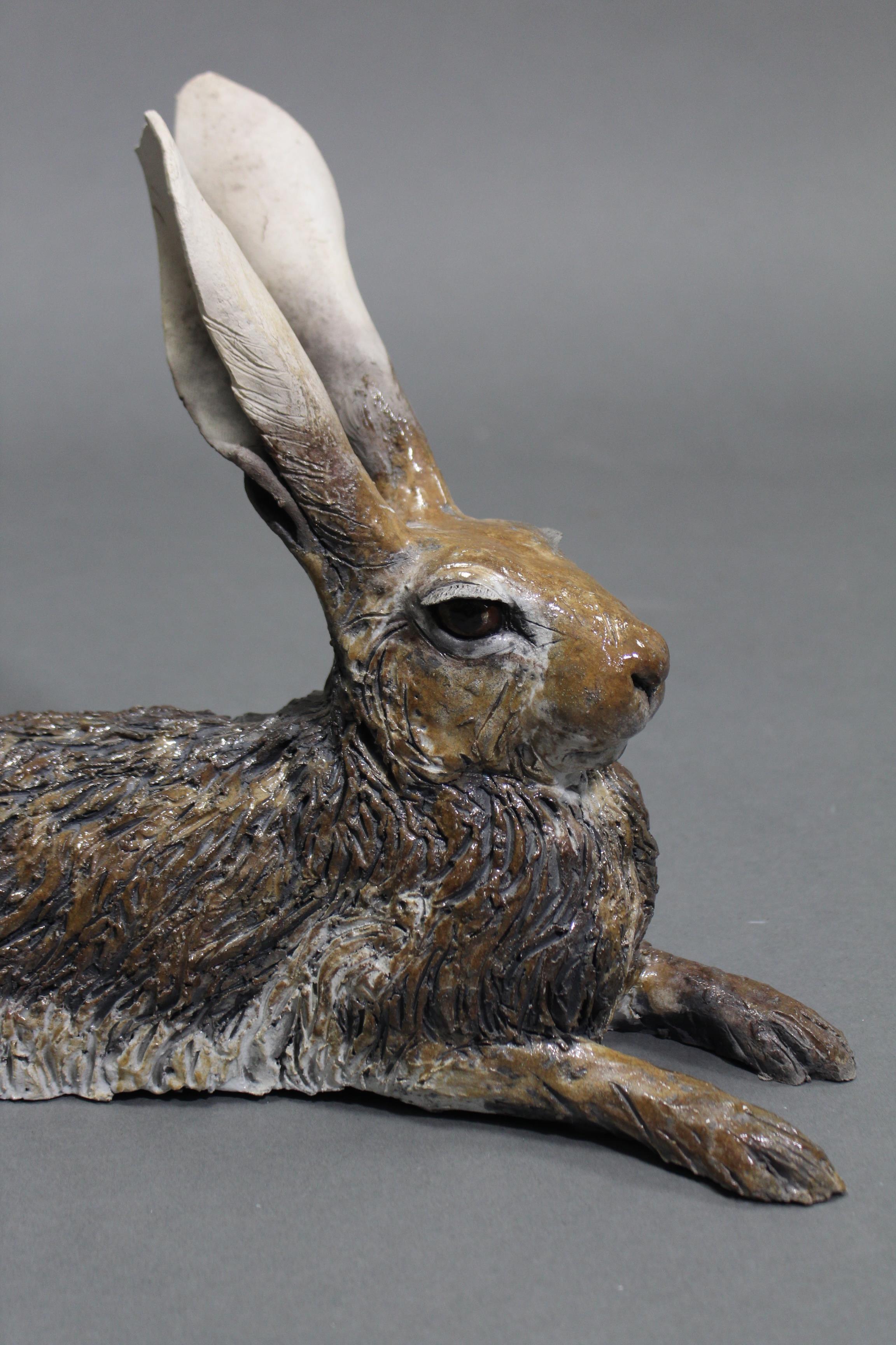 NICK MACKMAN; a contemporary ceramic sculpture titled: “Lying Down Hare”, glazed in naturalistic - Image 2 of 5