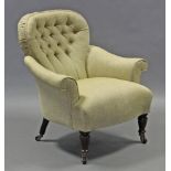 A Victorian armchair with rounded buttoned-back, scroll arms, & padded seat upholstered pale green