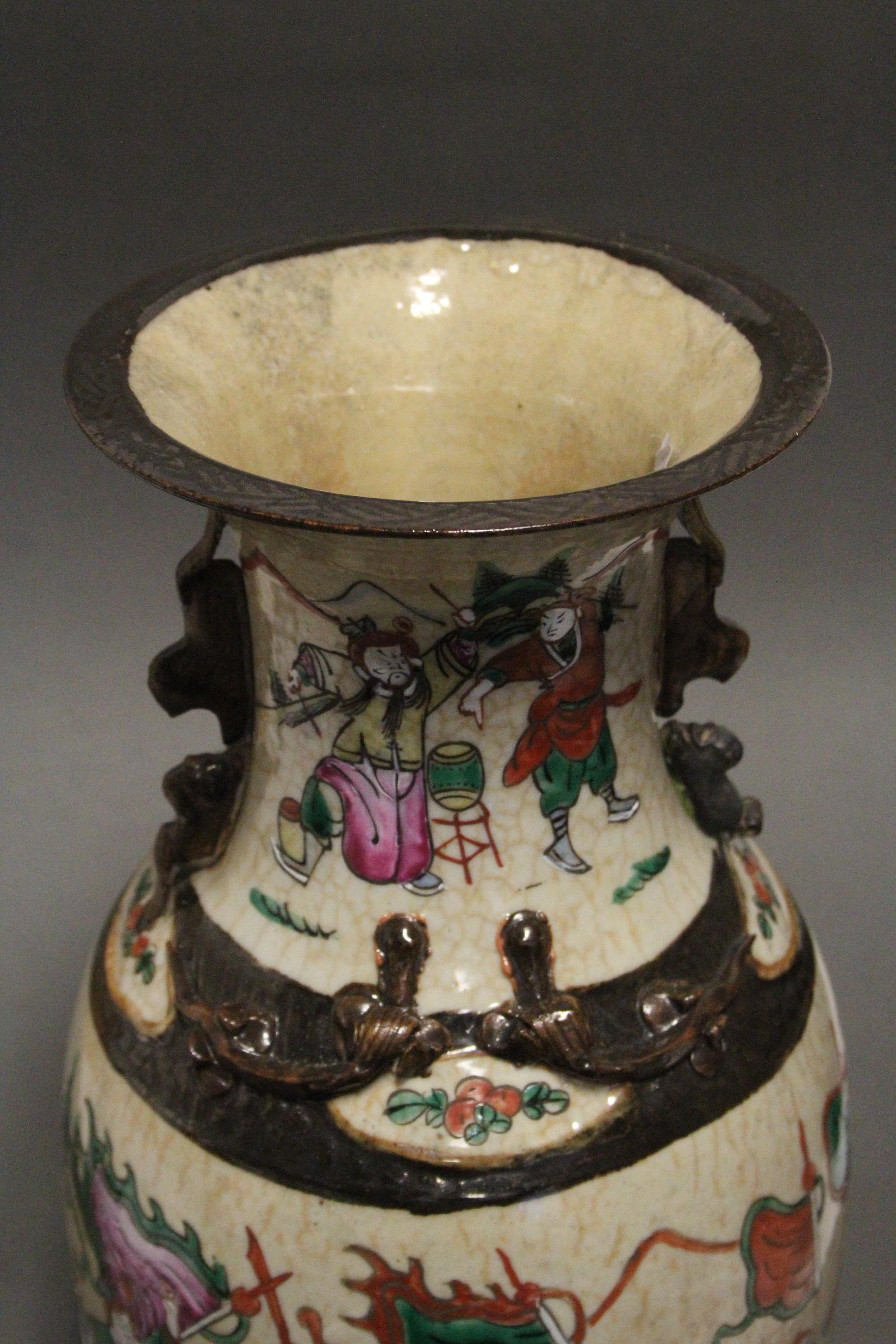 A Chinese “crackleware” baluster vase with rose-verte enamel decoration of warriors on a cream - Image 2 of 3