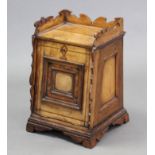 A 19th century stationery cabinet, constructed of various contrasting woods, with shaped tray top