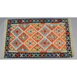 A Choli kelim vegetable-dye rug with central panel of lozenges & multicoloured geometric design