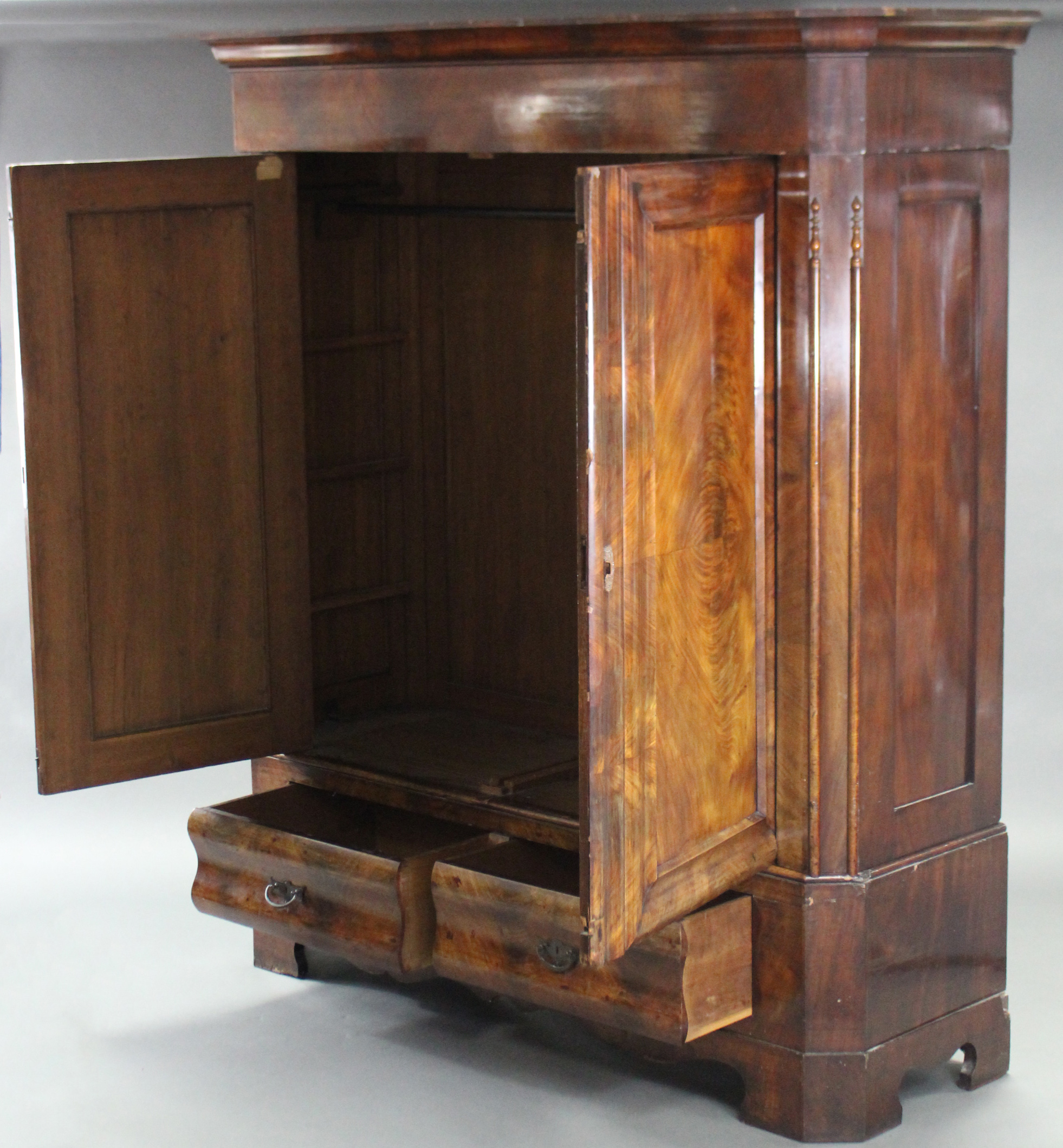 A 19th century CONTINENTAL FIGURED MAHOGANY WARDROBE, the upper part with cavetto cornice & enclosed - Image 2 of 3
