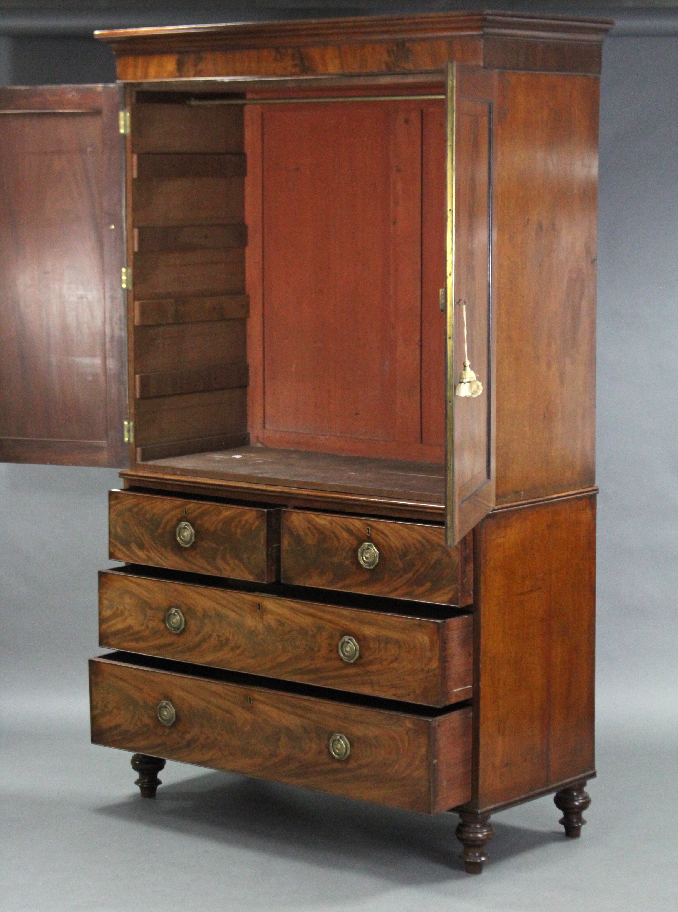 An early 19th century mahogany linen press enclosed by pair of fielded panel doors above two short - Image 2 of 2