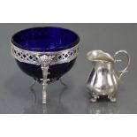 A 19th century Swedish silver small jug of ovoid shape with flared rim, scroll handle & shell-shaped