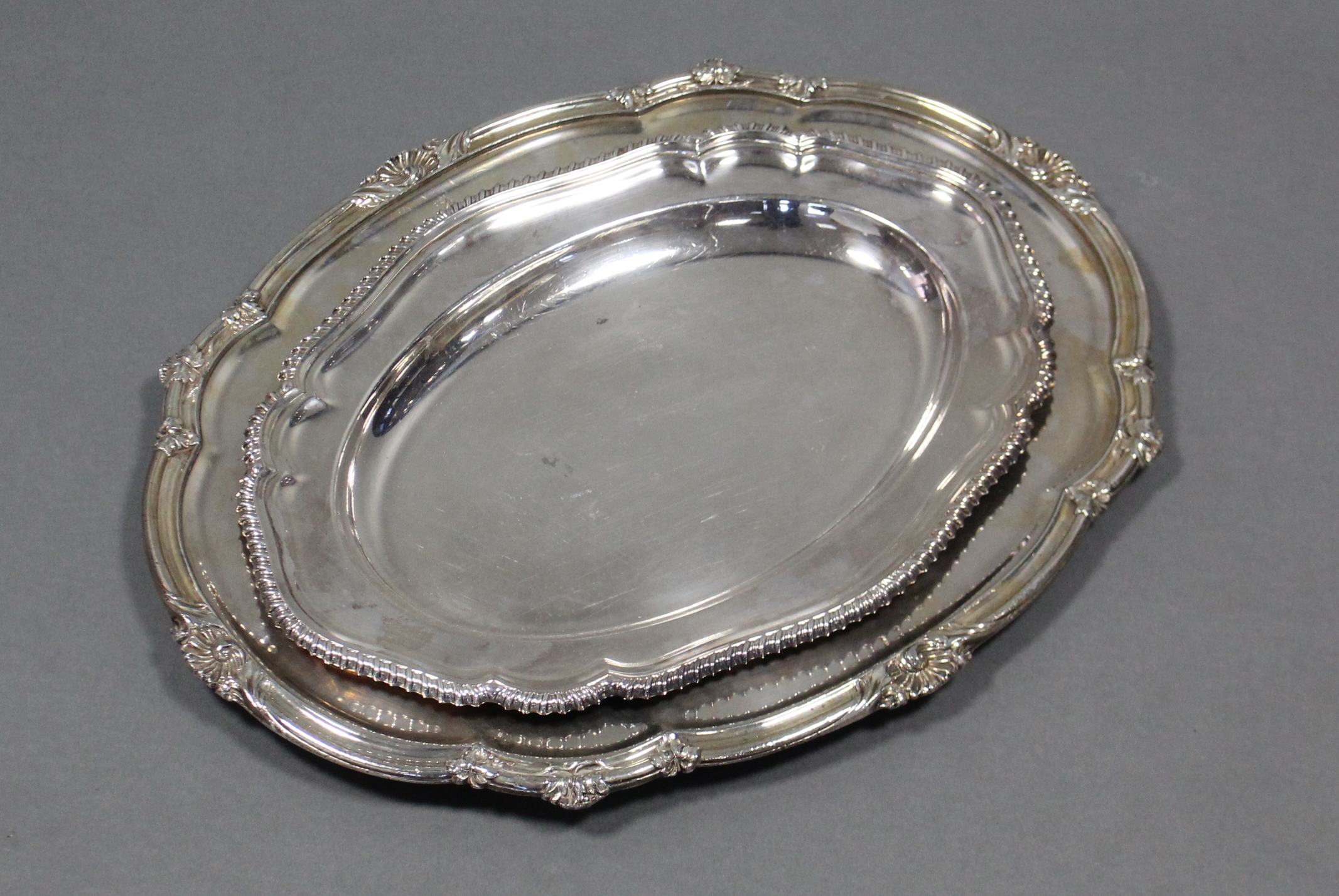 A Sheffield plated oval meat plate with shaped & moulded shell & leaf-scroll rim, an engraved