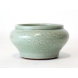 A Chinese Longquan celadon bowl, of squat baluster form, finely carved with trailing flowers above a