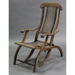 A beech frame folding deck chair with woven cane panel to the seat & back