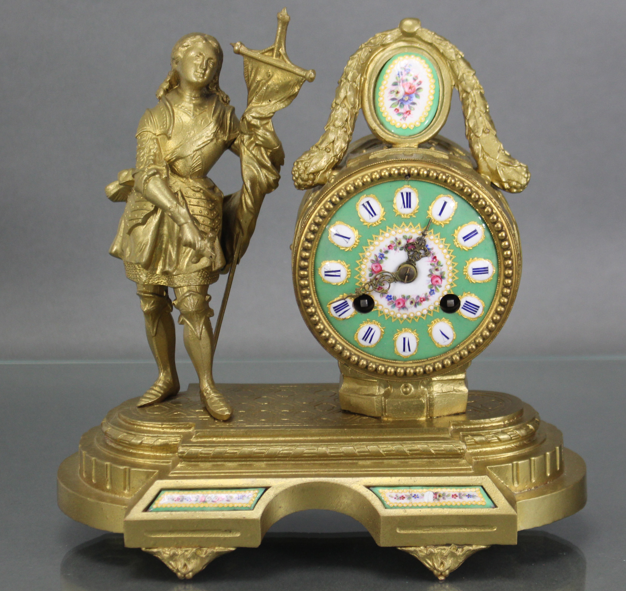 A 19th century French figural mantel clock by Brevet, the 3” green enamel dial with floral