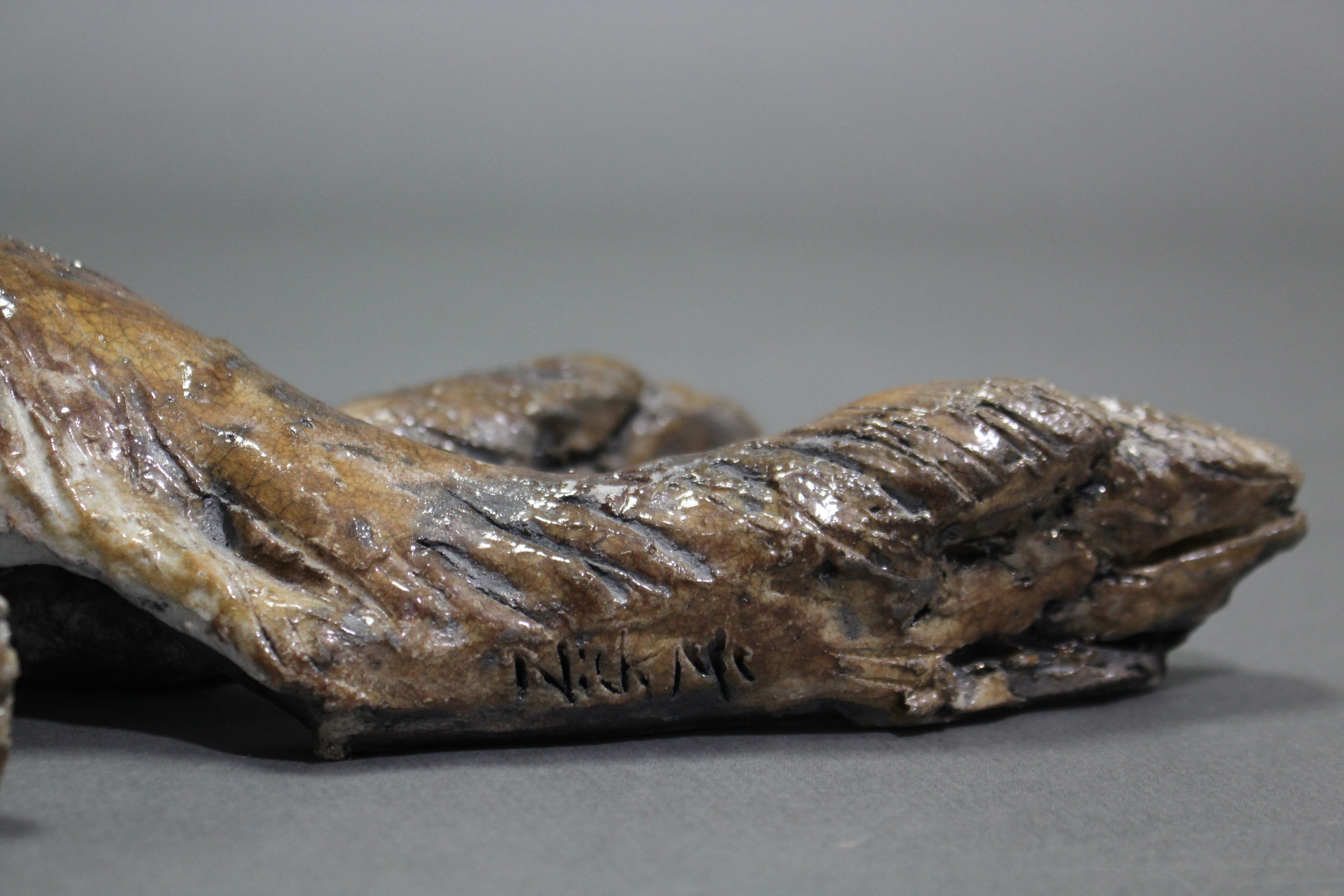 NICK MACKMAN; a contemporary ceramic sculpture titled: “Lying Down Hare”, glazed in naturalistic - Image 5 of 5