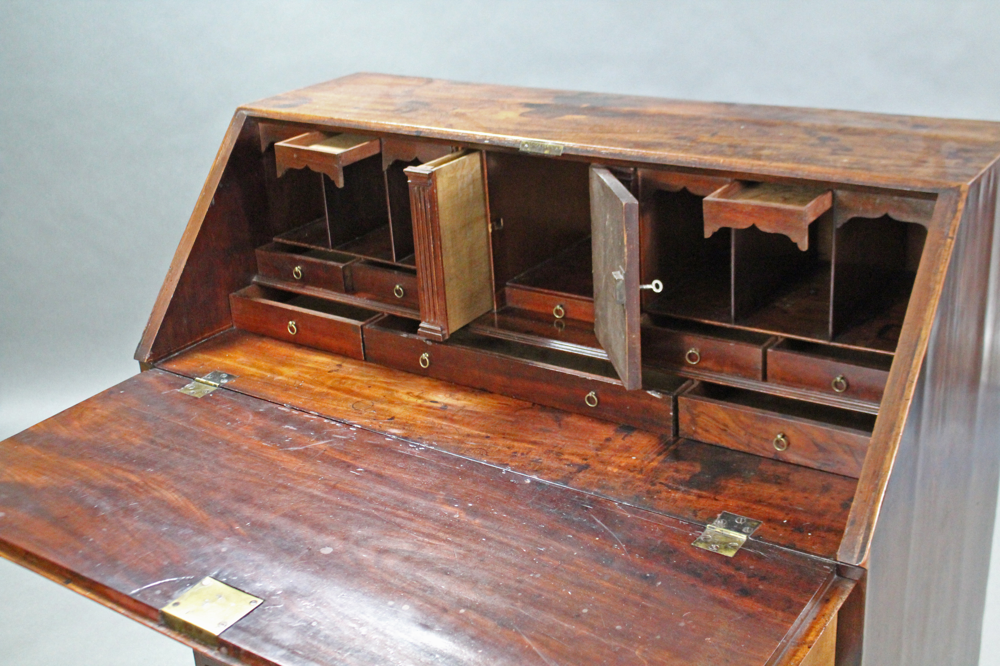 A George III mahogany bureau, the sloping fall-front enclosing a fitted interior above two short & - Image 3 of 3