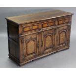 A good quality 18th century style oak dresser base with mahogany crossbanding, fitted three frieze