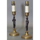 A pair of 19th century bronze & gilt bronze candlesticks in the neo-classical style, each with
