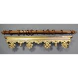 A carved & pierced giltwood & gesso curtain pelmet with foliate & acorn drop-finials, 57” wide;