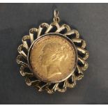 A Victorian sovereign pendant, the coin dated 1885 (Melbourne mint), in later 9ct. gold pierced