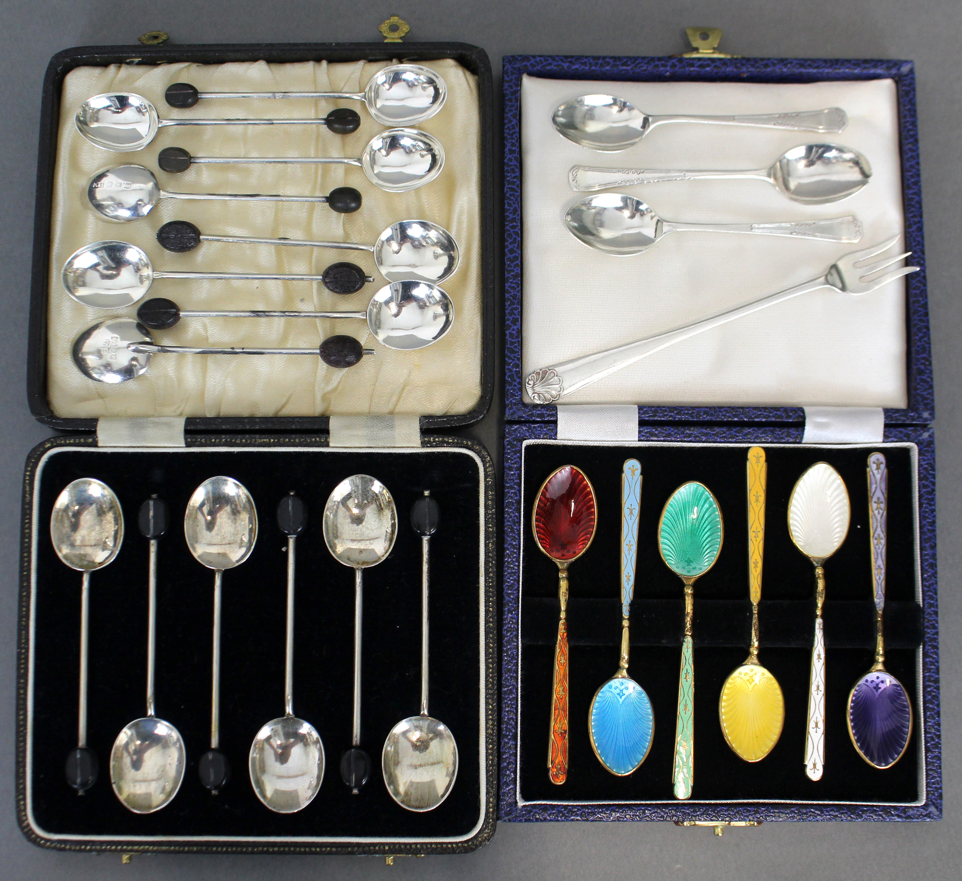 A set of six silver-gilt & harlequin enamel coffee spoons, Birmingham 1974, in fitted case; a set of