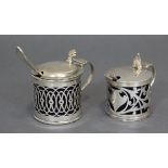A late Victorian silver mustard pot of pierced drum shape, Birmingham 1897; & a similar mustard pot,