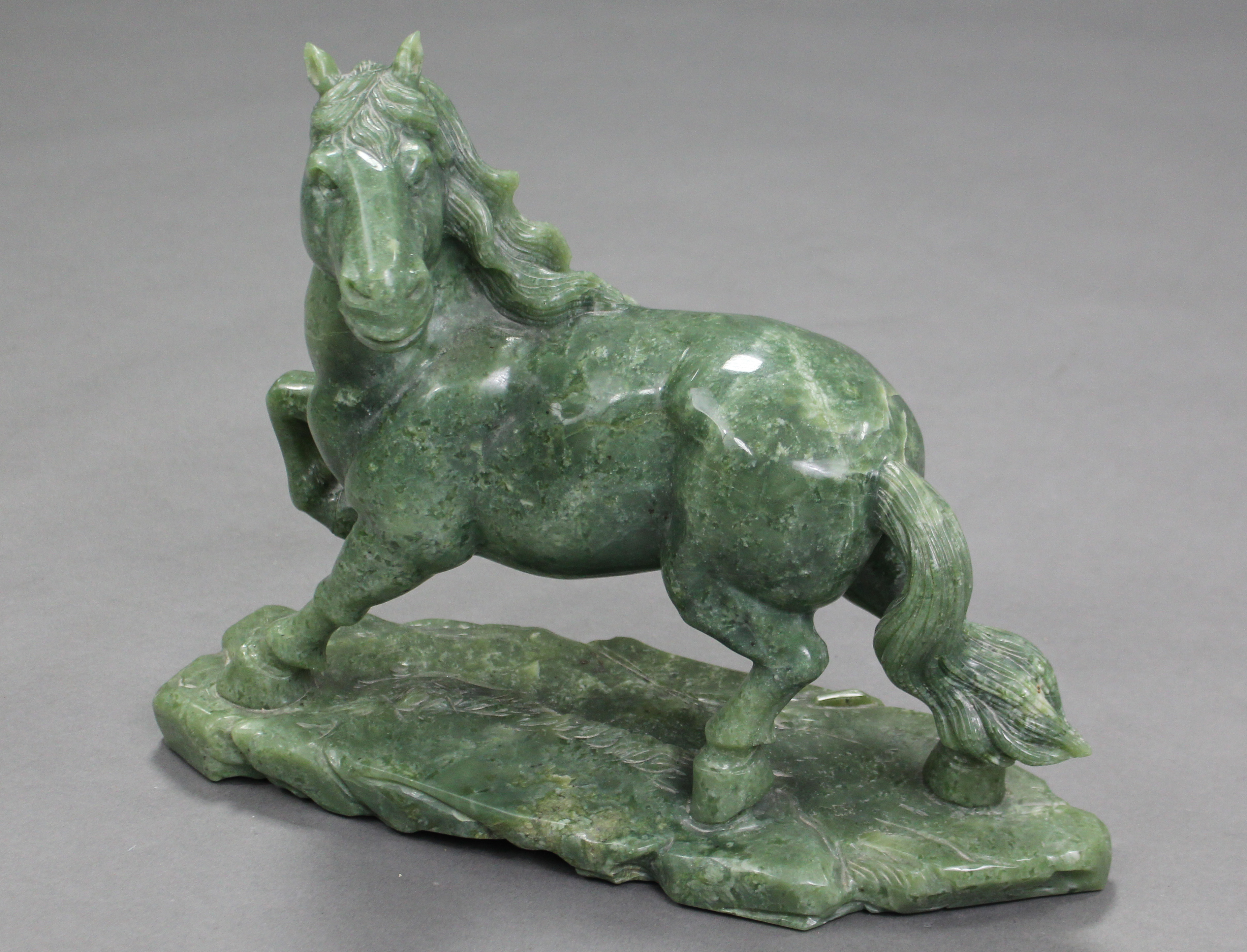A LARGE CARVED GREEN JADE-ITE MODEL OF A HORSE, its right leg raised & head turned to the left, with - Image 3 of 4