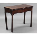 An 18th century mahogany serpentine-shaped card table, the fold-over top inset green baize, on